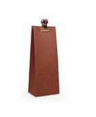 Een warm terracotta gekleurd cadeauzakje met een elegante koperen clip, perfect als bedankje.