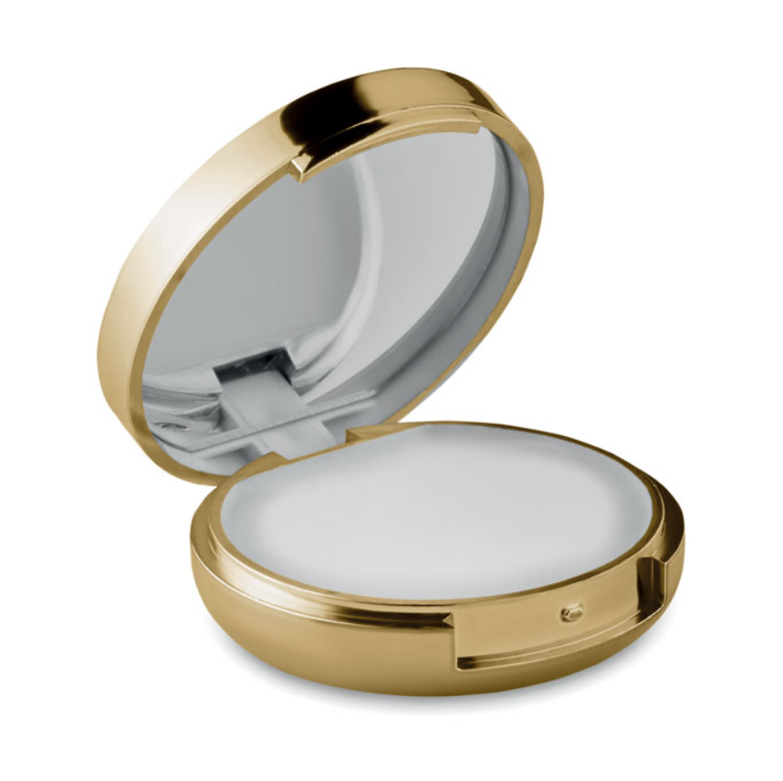 Luxe gouden lippenbalsem geopend met zichtbaar spiegeltje en witte vanillebalsem.